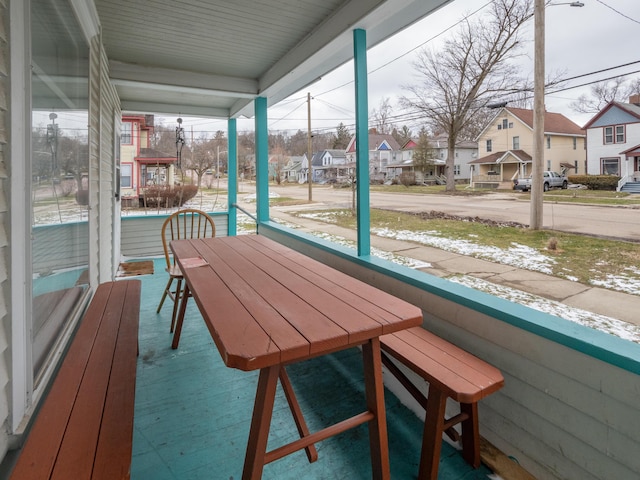 unfurnished sunroom featuring a residential view