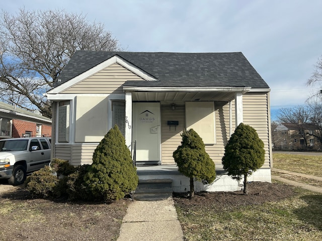 bungalow-style house with roof with shingles