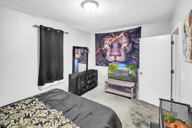 bedroom featuring carpet floors and a textured ceiling