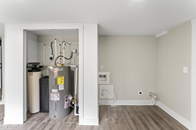 utility room featuring electric water heater