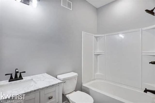 full bathroom with toilet, tub / shower combination, vanity, and visible vents