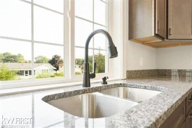 details with light stone counters and a sink