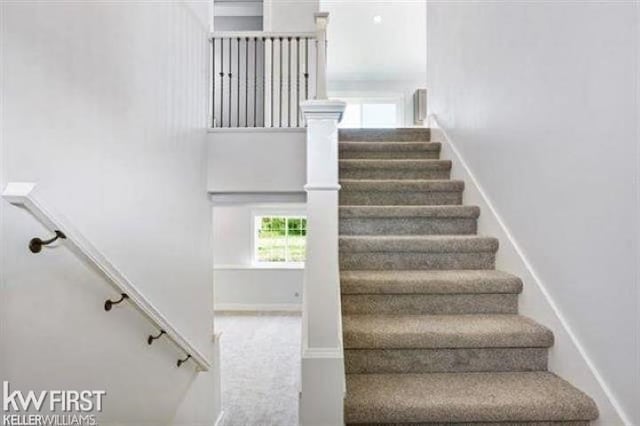 stairway featuring baseboards