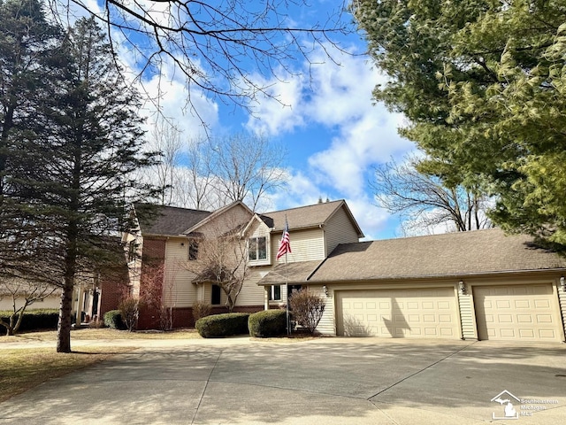 view of front of house with a garage and driveway