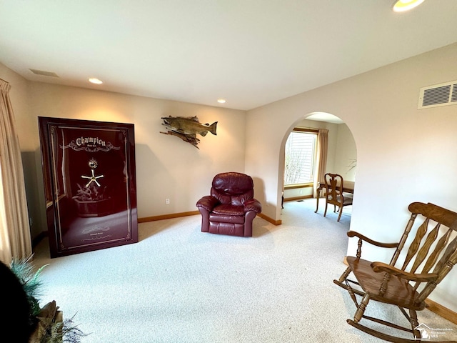 sitting room with visible vents, arched walkways, baseboards, carpet flooring, and recessed lighting