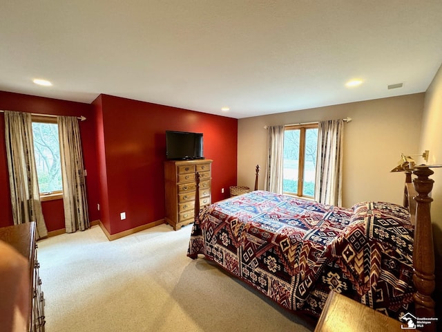 carpeted bedroom featuring recessed lighting, visible vents, and baseboards