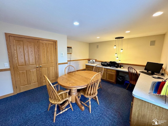 dining area with recessed lighting, dark carpet, and built in study area