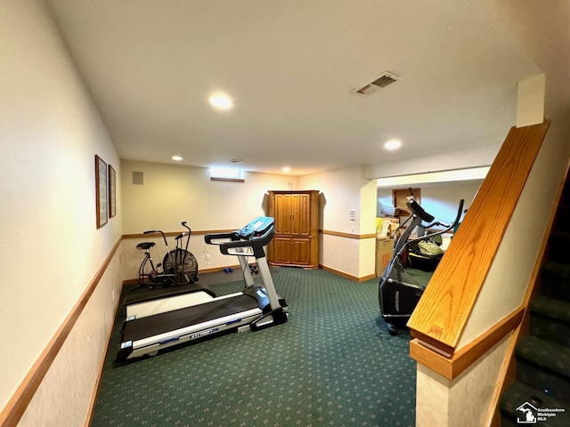 workout area featuring baseboards, dark colored carpet, visible vents, and recessed lighting