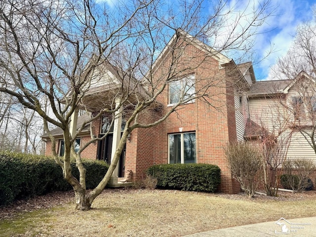 view of property exterior featuring brick siding