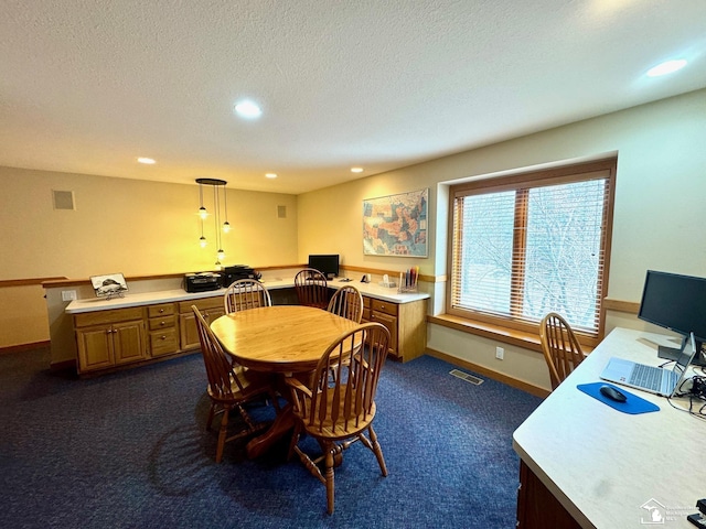 dining room with visible vents, dark carpet, a textured ceiling, and recessed lighting