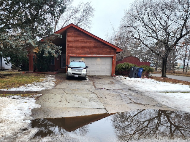 view of home's exterior with driveway and an attached garage