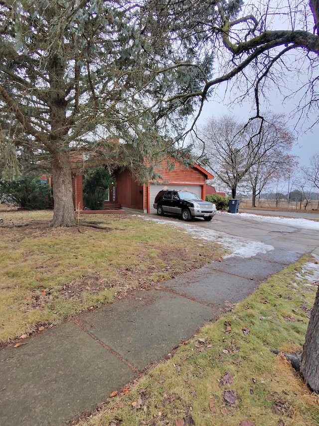 exterior space featuring a garage and concrete driveway