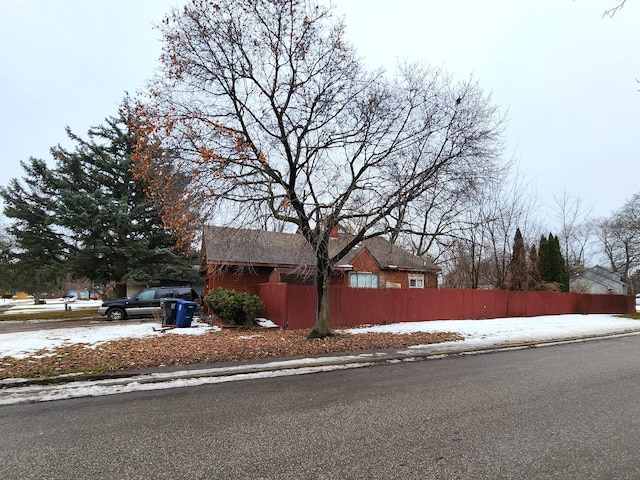 view of property exterior with a fenced front yard