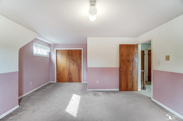 bonus room featuring carpet floors and baseboards