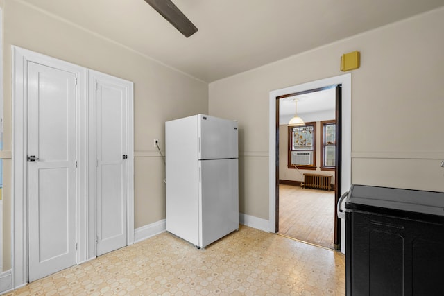 2412 Cornell St, Dearborn, MI 48124 - kitchen featuring light floors, radiator, electric range oven, freestanding refrigerator, and baseboards