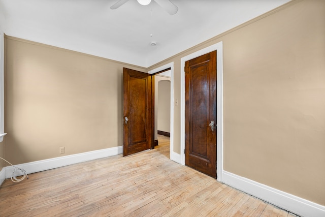2412 Cornell St, Dearborn, MI 48124 - unfurnished bedroom featuring a ceiling fan, light wood-style flooring, and baseboards