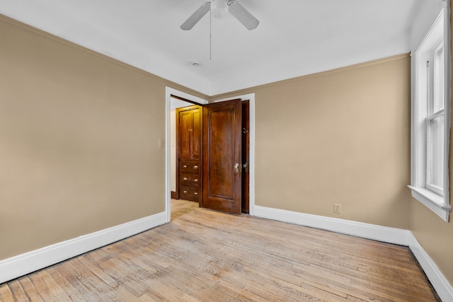 2412 Cornell St, Dearborn, MI 48124 - empty room with hardwood / wood-style flooring, baseboards, a ceiling fan, and ornamental molding