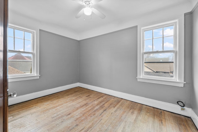 2412 Cornell St, Dearborn, MI 48124 - empty room featuring hardwood / wood-style floors, plenty of natural light, a ceiling fan, and baseboards