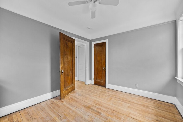 2412 Cornell St, Dearborn, MI 48124 - empty room with a ceiling fan, baseboards, and hardwood / wood-style flooring