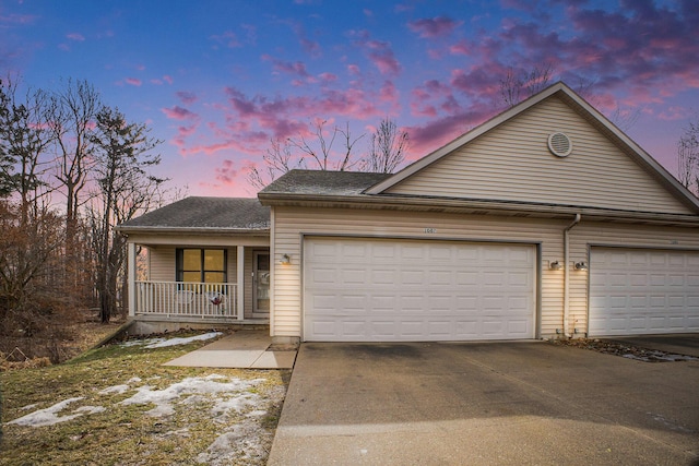 single story home featuring a garage, covered porch, roof with shingles, and driveway