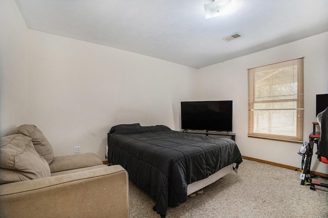 bedroom with carpet, visible vents, and baseboards