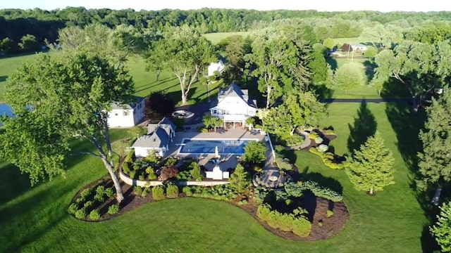 aerial view featuring a wooded view