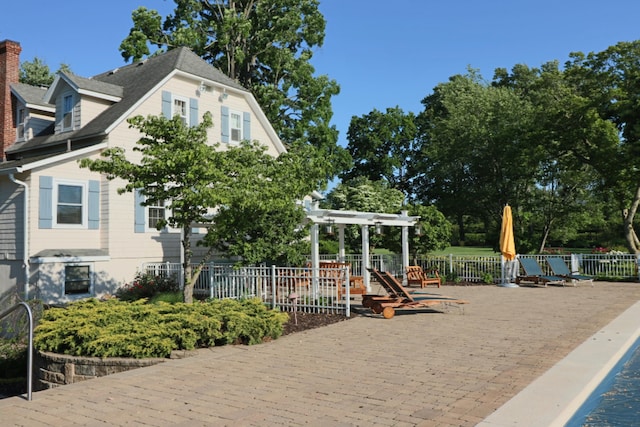 exterior space featuring fence, a patio, and a pergola