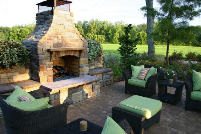 view of patio featuring an outdoor living space with a fireplace