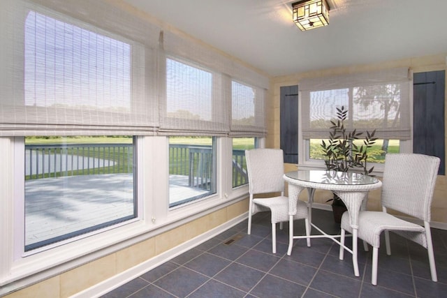 sunroom with a water view