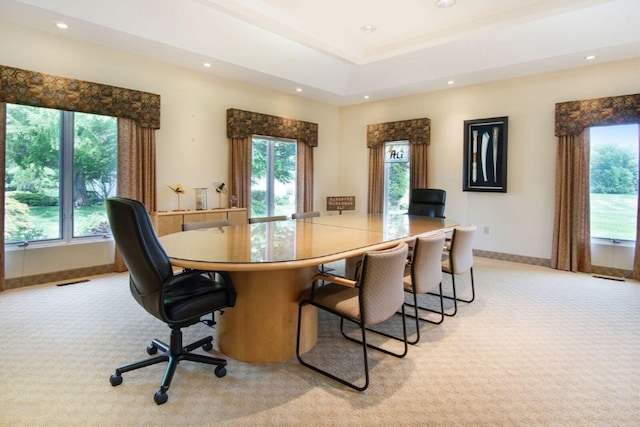 dining space with recessed lighting, light colored carpet, visible vents, baseboards, and a raised ceiling