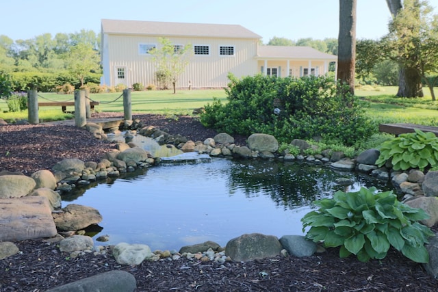 view of water feature with a small pond