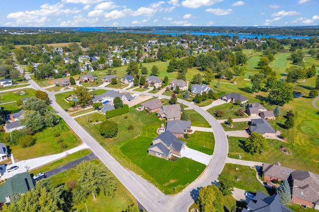 bird's eye view featuring a water view and a residential view