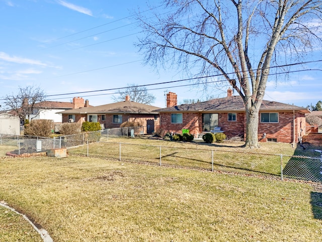 ranch-style home with a fenced front yard, a front yard, a chimney, and brick siding