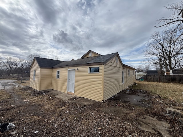 back of property featuring fence