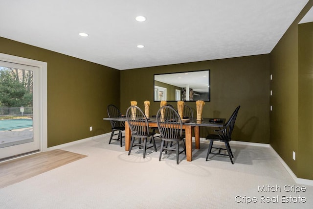 carpeted dining room featuring recessed lighting and baseboards