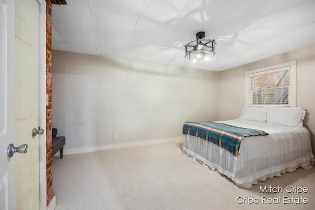 bedroom with carpet and baseboards