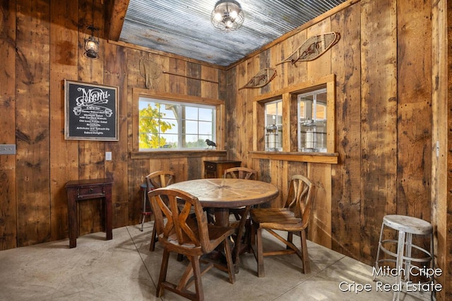 dining area with wooden walls