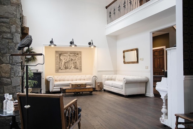 interior space with a high ceiling and wood finished floors