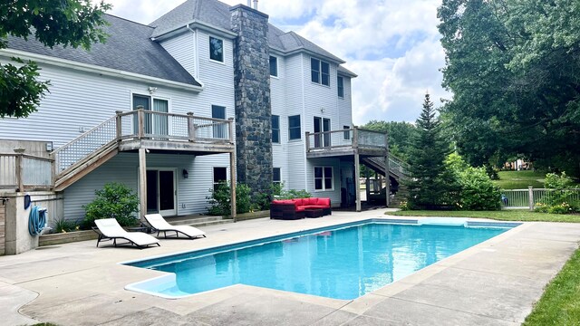 14186 S Mocking Bird Ln, Grant, MI 49327 - view of pool featuring stairs, a patio area, and outdoor lounge area