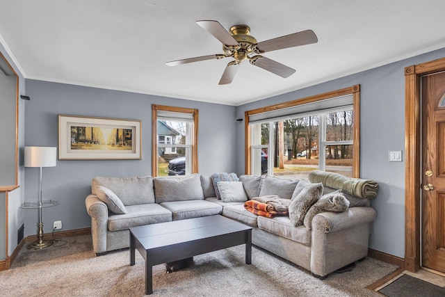 living room featuring carpet, ceiling fan, and baseboards