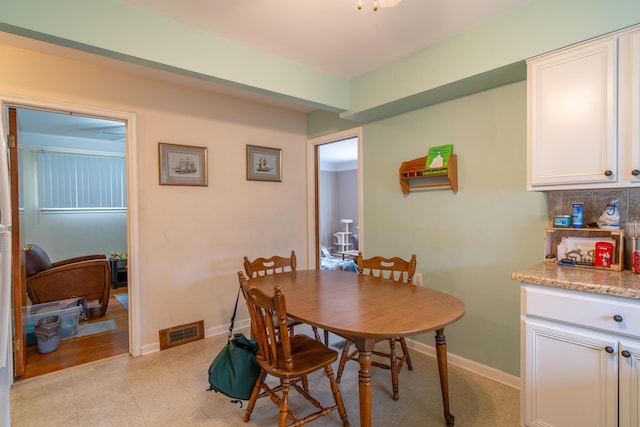 dining area featuring baseboards and visible vents