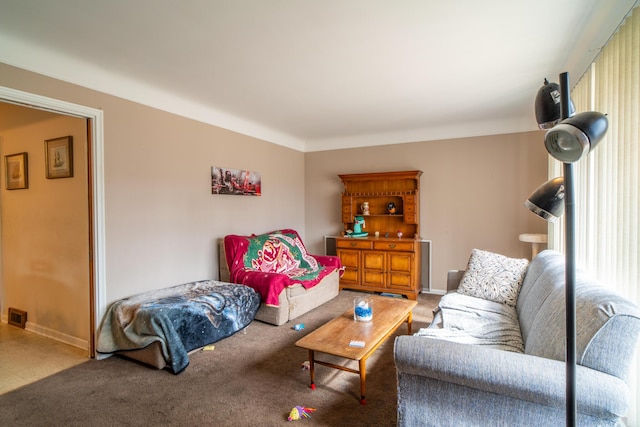 living area with carpet floors and baseboards