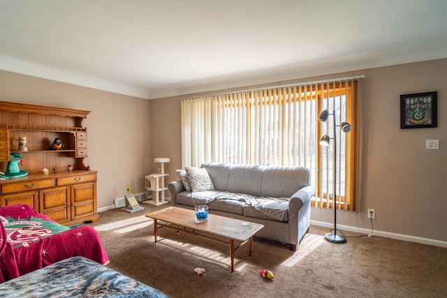 living area featuring carpet floors and baseboards