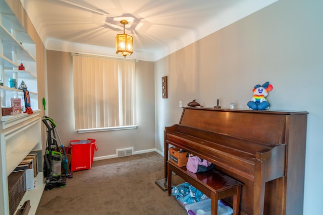 living area featuring carpet, visible vents, and baseboards