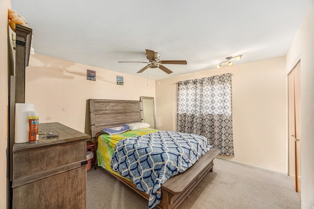 bedroom with ceiling fan and carpet flooring