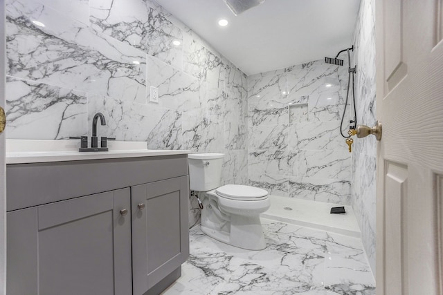 full bath with toilet, stone wall, a marble finish shower, and vanity