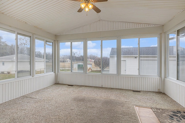 unfurnished sunroom featuring a ceiling fan and lofted ceiling