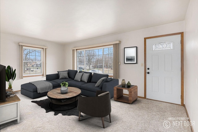 living room with carpet and baseboards