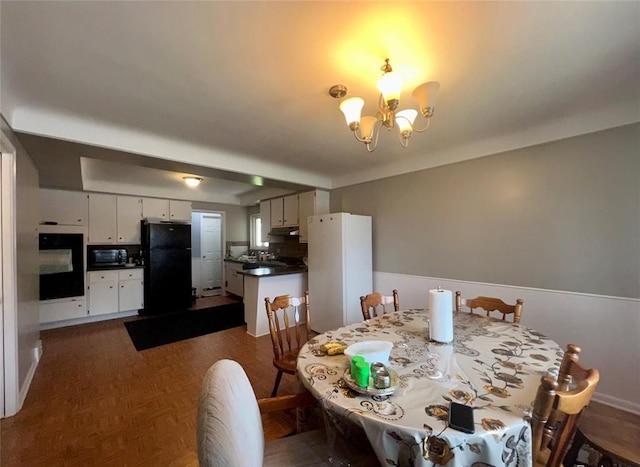 dining area featuring a notable chandelier