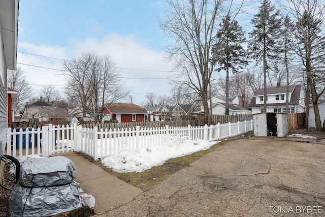 view of yard with a fenced front yard and a residential view